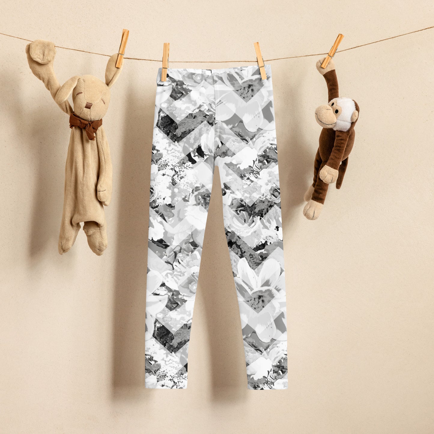 Kids Lola leggings in Cloud Bloom Chevron print hanging on line showcasing floral print