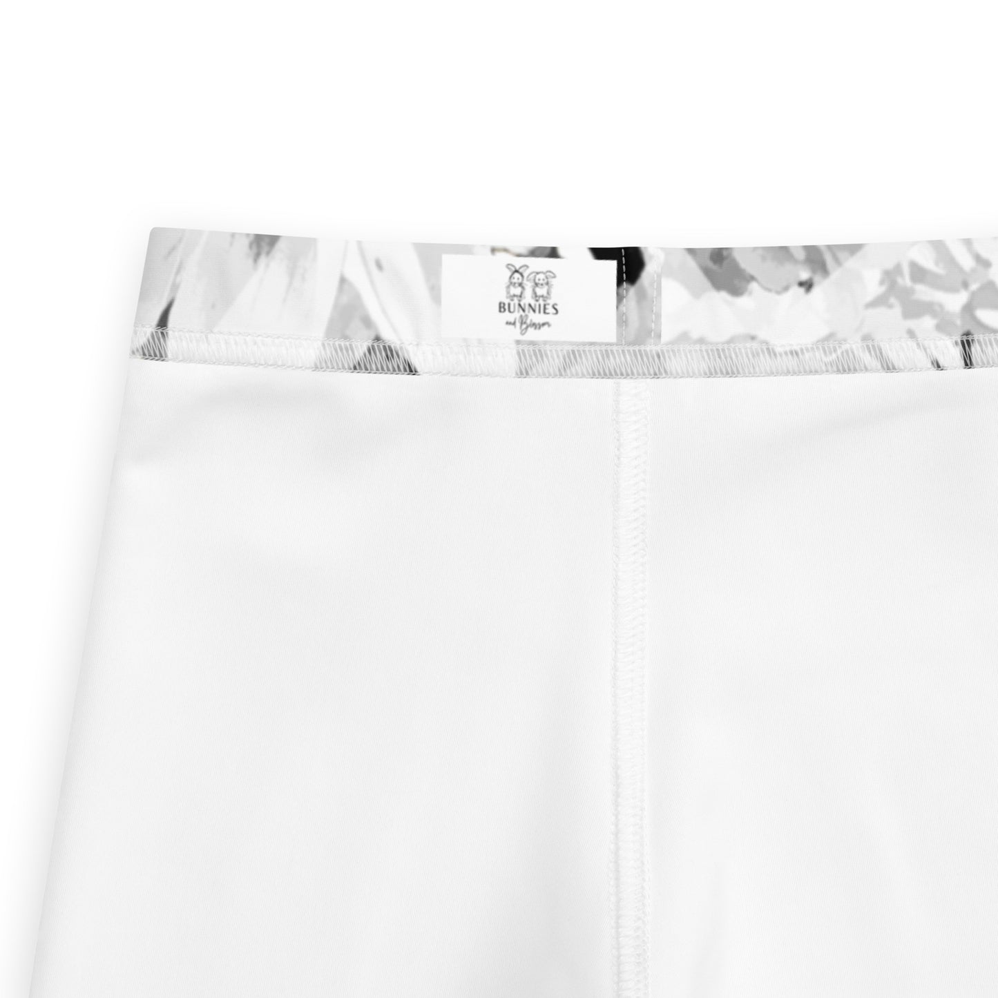 close up of kids printed leggings branded label showing Bunnies and Blossom logo