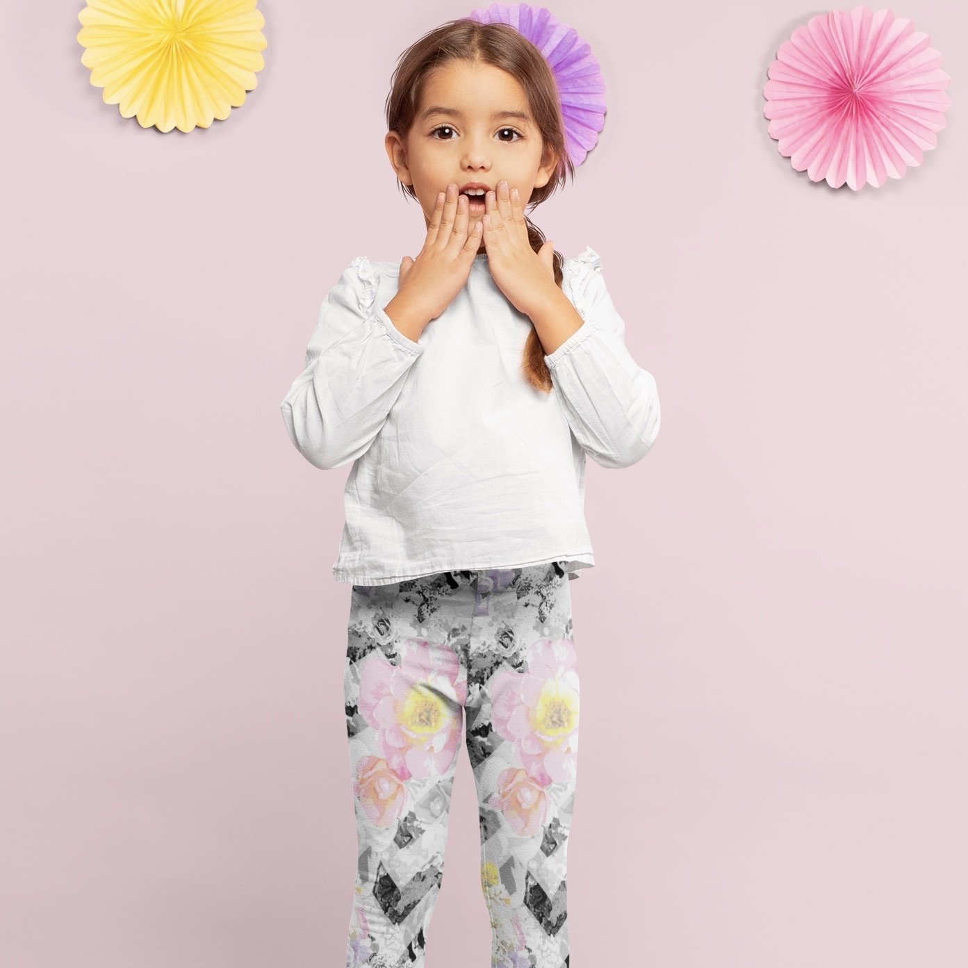 Girl wearing Bunnies and Blossom printed floral leggings in delicate bloom chevron print